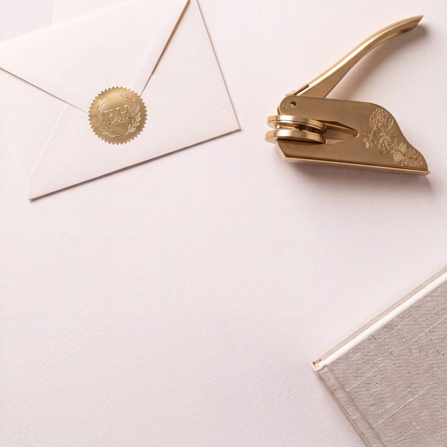 The book-shaped keepsake box tied with a pale gold ribbon