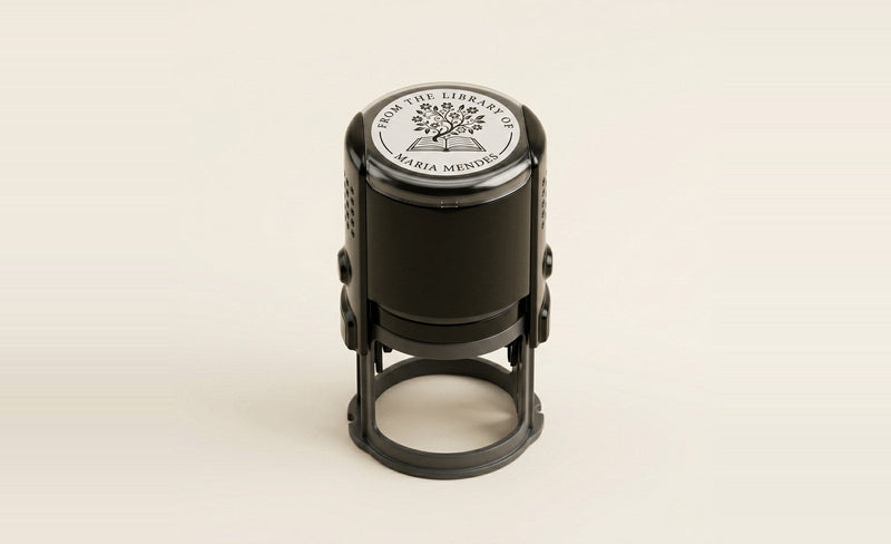 Self-inking personal library stamp reading From the Library of