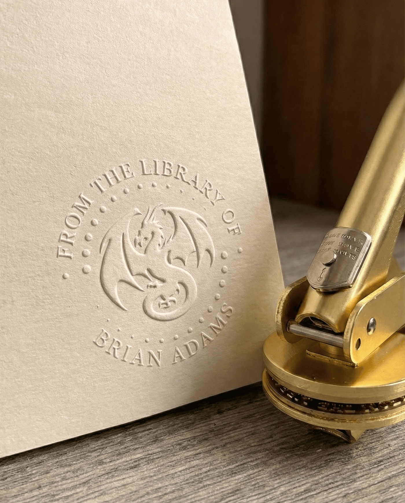 A close-up of a clean, deep emboss pressed into cream paper.