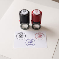 Personalised couple portrait stamp printed in black, blue and red ink, with the black and red stamp cases
