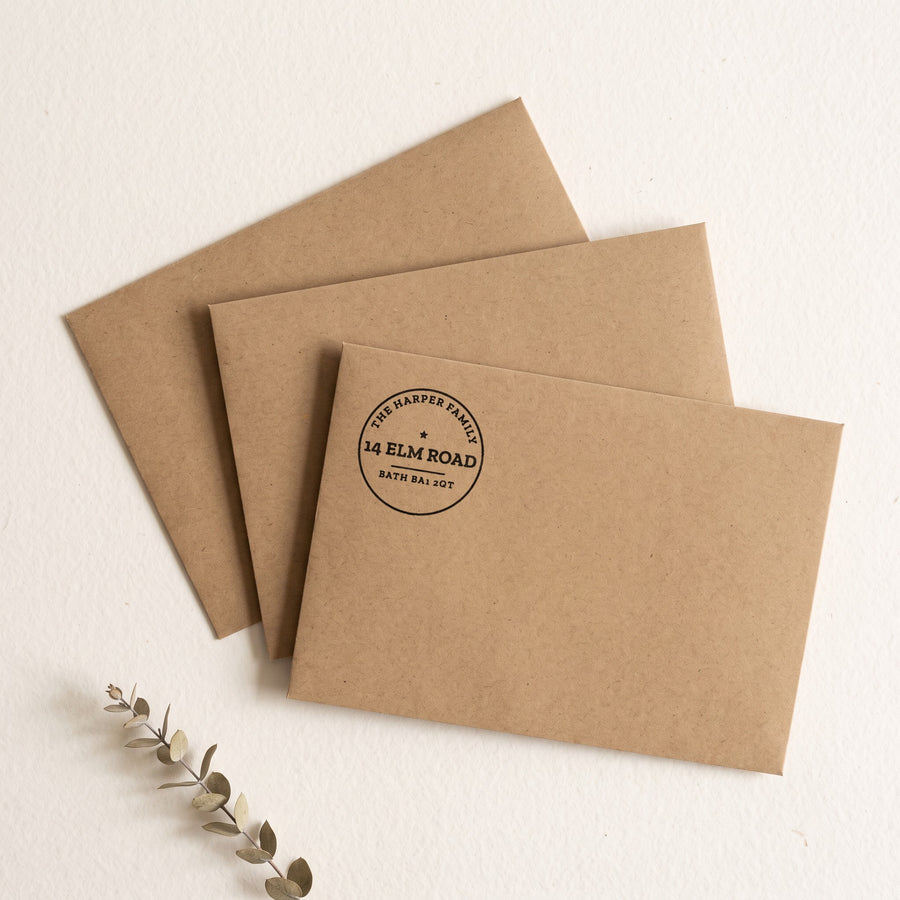 Personalised return address stamp prints on kraft envelopes