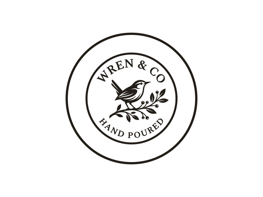 A small business logo stamp: a wren on a branch, WREN AND CO, HAND POURED
